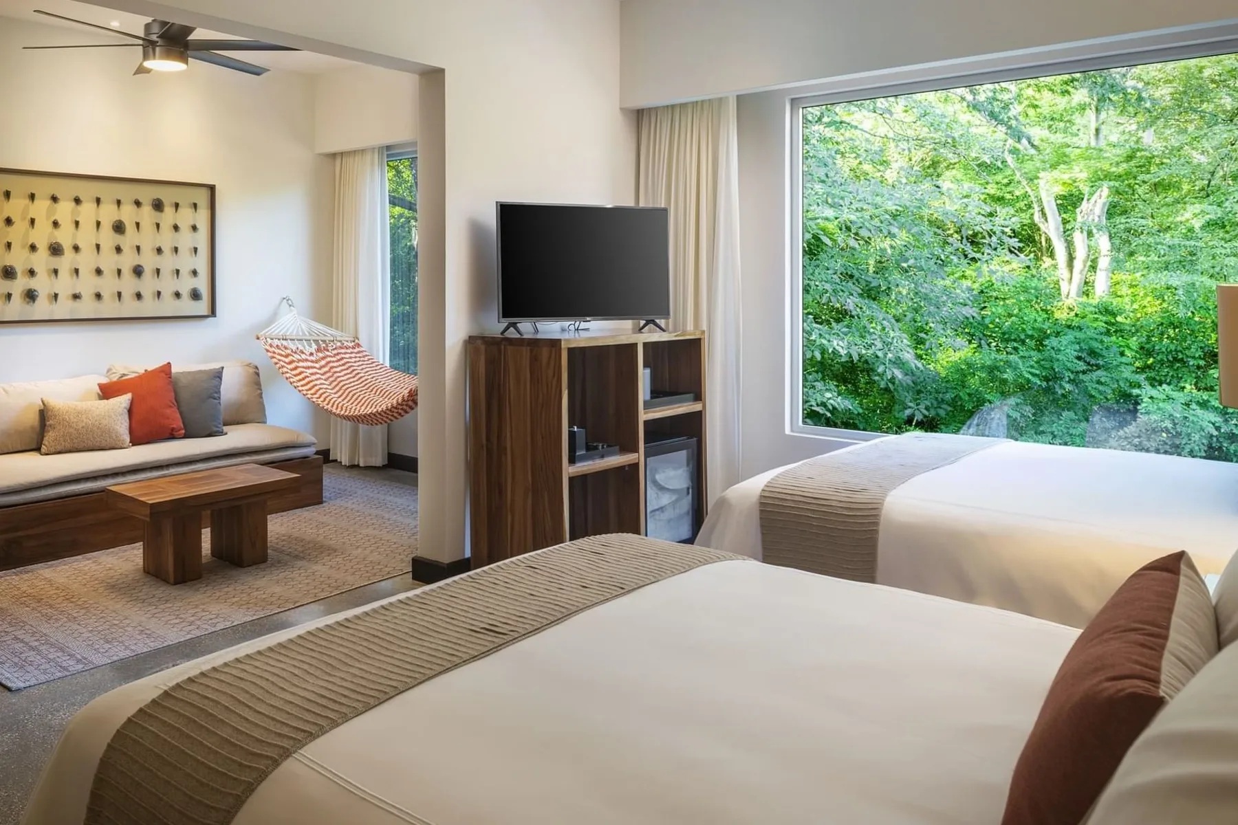 Resort Suite 2 Queen Beds with TV, sofa and a greeny outside view at El Mangroove Hotel